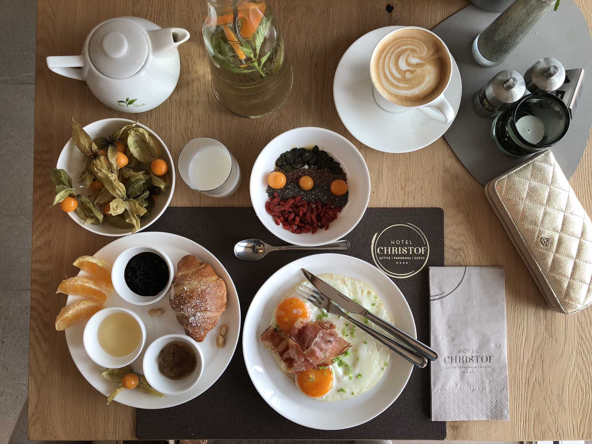 Breakfast begins with a generous buffet and a well-balanced selection Breakfast table with eggs, croissants, fruit, grains, jam, coffee and tea